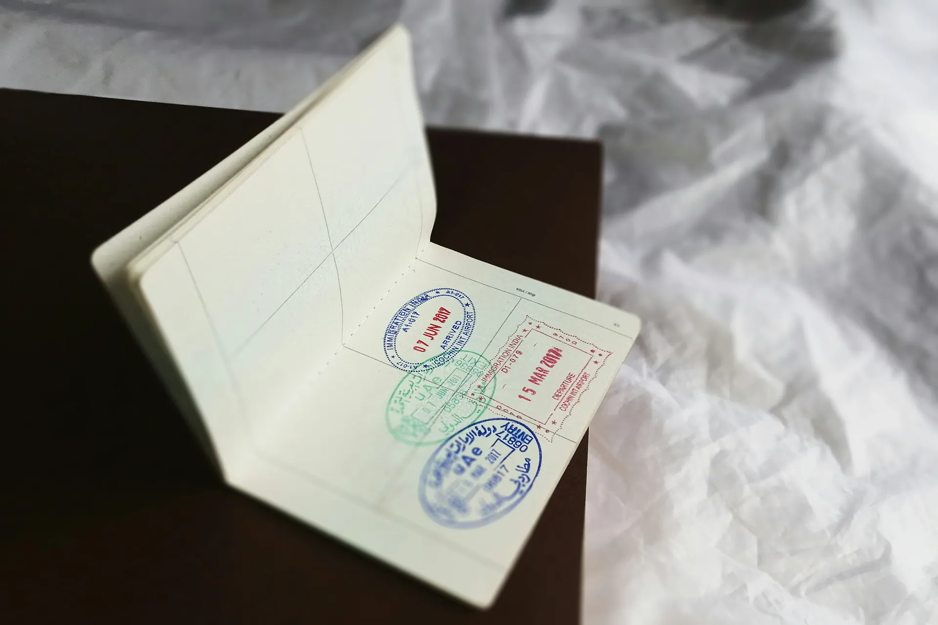 Visa stamps on an open passport