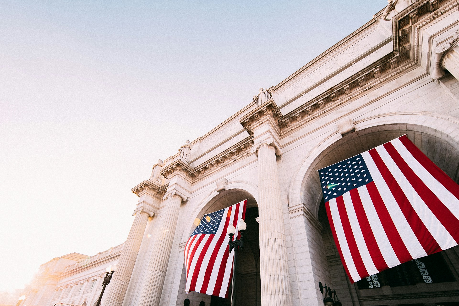 American flags hanging outside a building