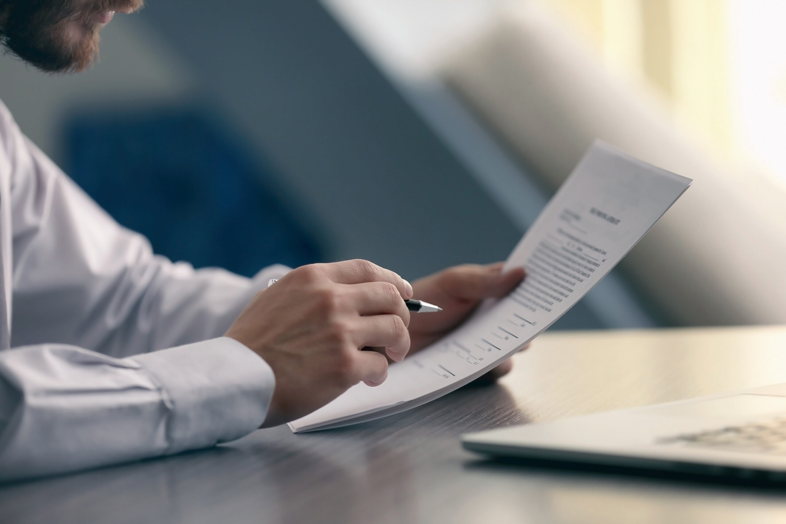 An employee signing paperwork.